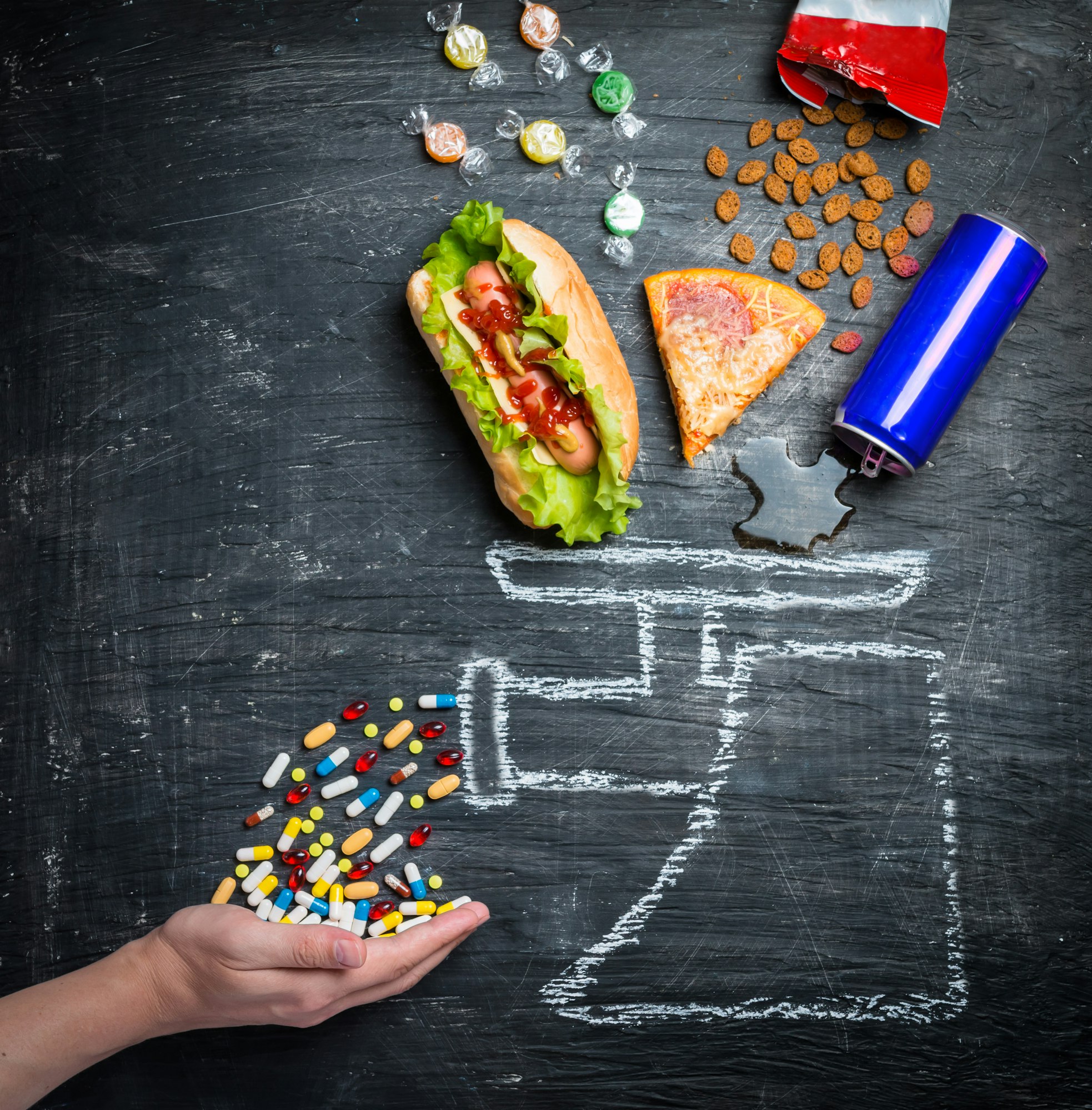 fast food and medicines on a black background