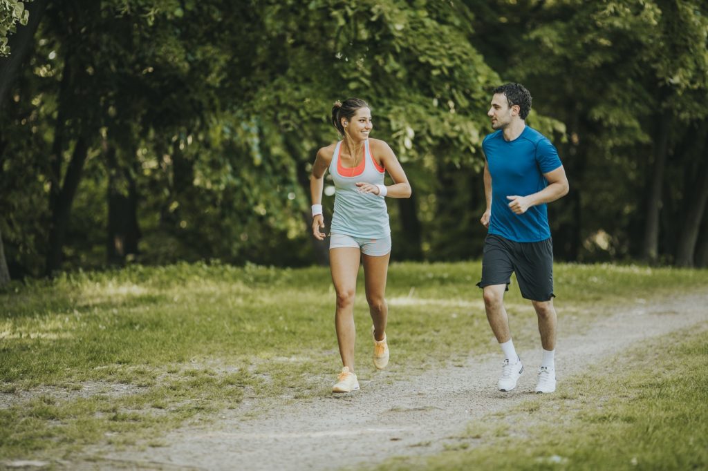 Young people jogging and exercising in nature