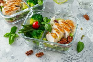 Healthy meal prep containers with chicken breast.